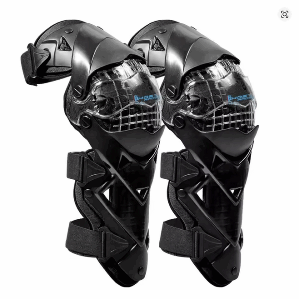 Motorcycle knee and shin guards laid out against a neutral background, showing full-length motocross protective pads with adjustable straps and reinforced armor panels.