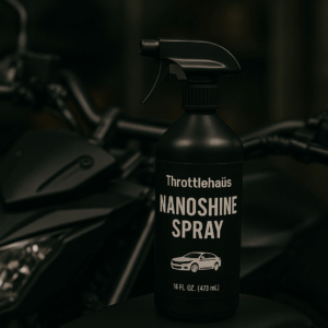 A clear photo of a Throttlehaüs NanoShine Spray bottle against a neutral background.
